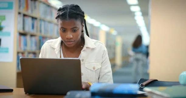 Figure Academy learner studying with a laptop